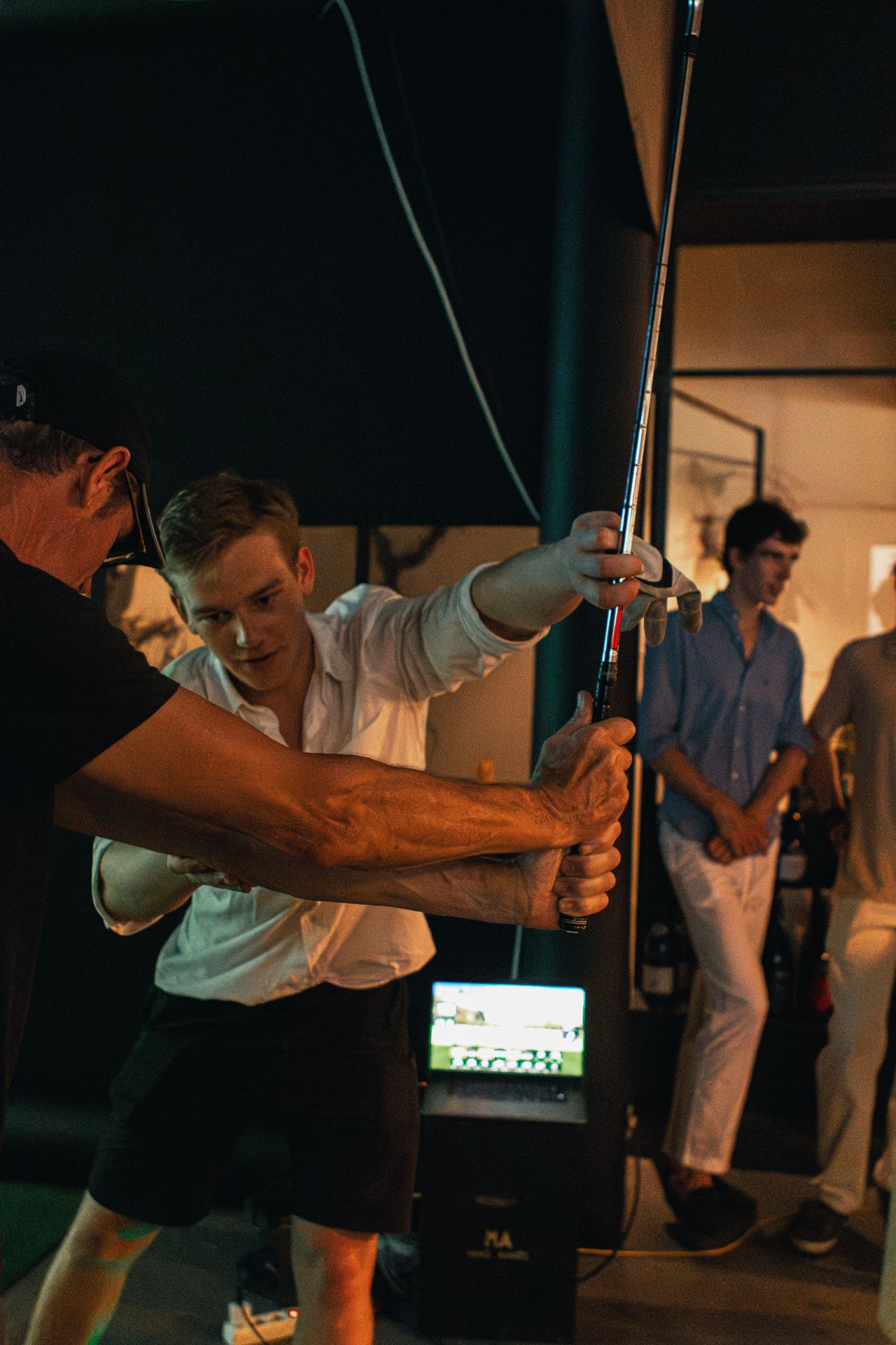 Guest getting swing guidance during a corporate ParTee event